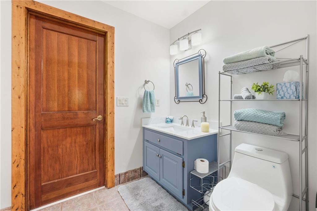 49 Rimrock Road Jasper, GA 30143 - Photo 38 of 61 a bathroom with a toilet a sink and mirror