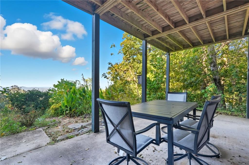 49 Rimrock Road Jasper, GA 30143 - Photo 56 of 61 a view of an outdoor space with a table and chairs