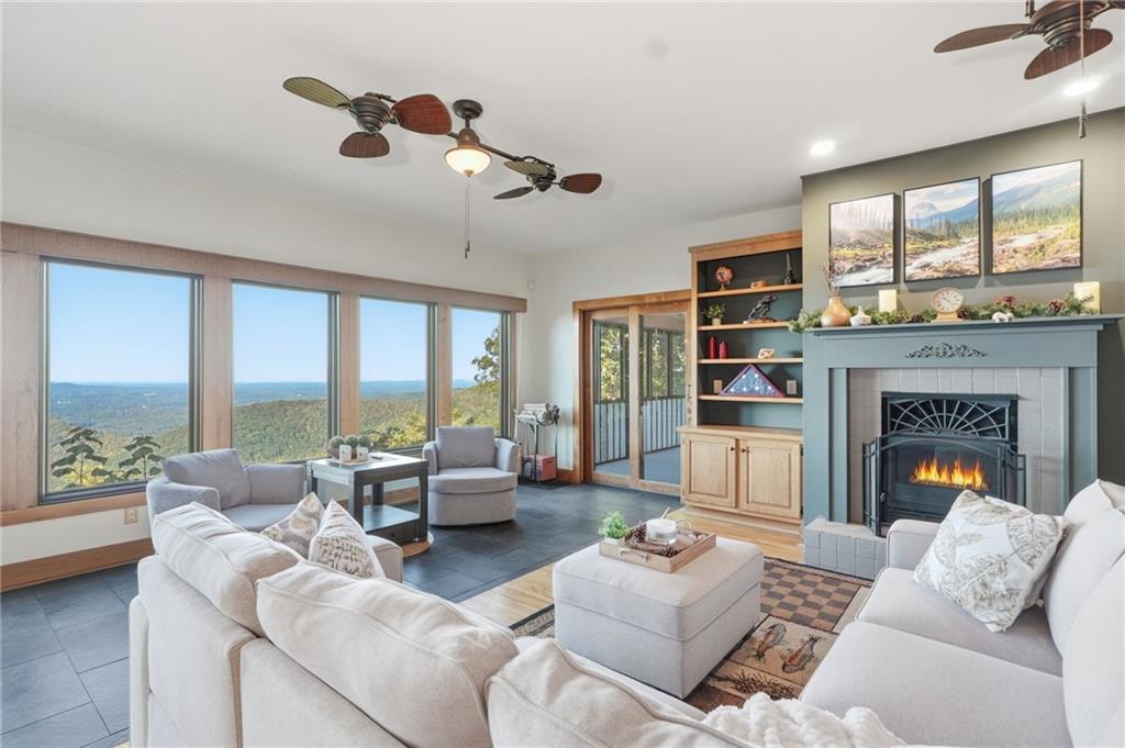 49 Rimrock Road Jasper, GA 30143 - Photo 6 of 61 a living room with furniture fireplace and a large window