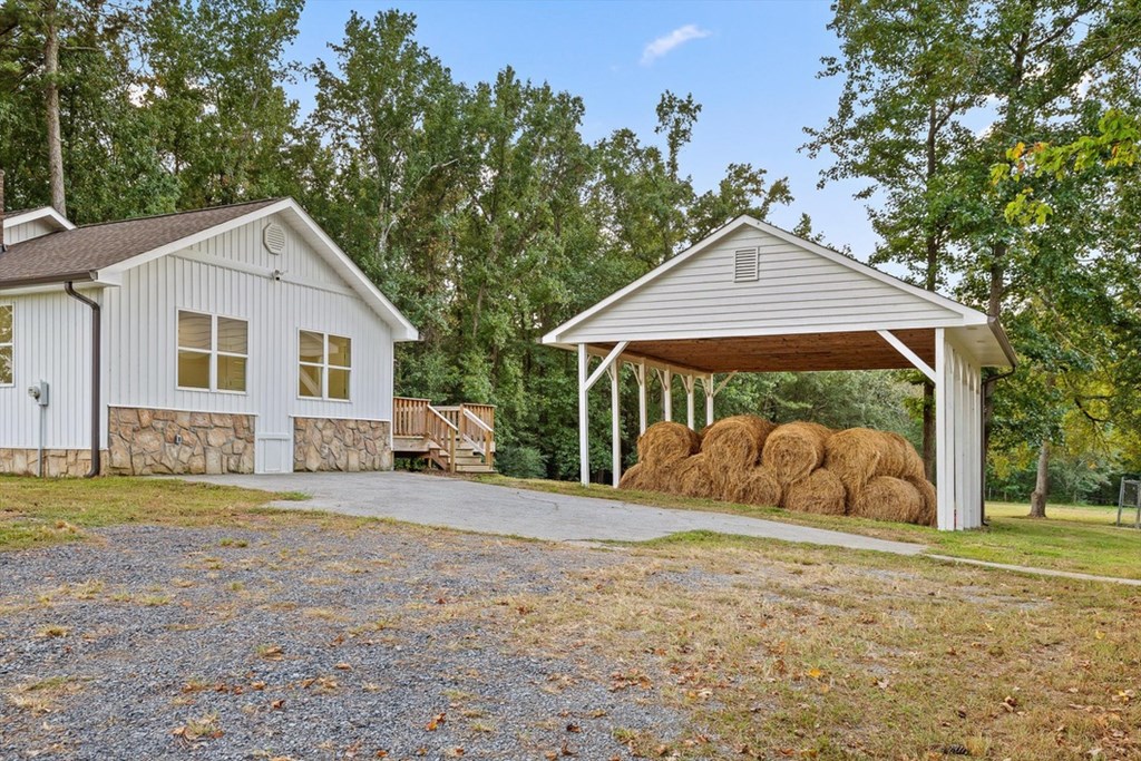 446 Brown Bridge Road Chatsworth, GA 30705 - Photo 40 of 77 a front view of a house with a yard and trees