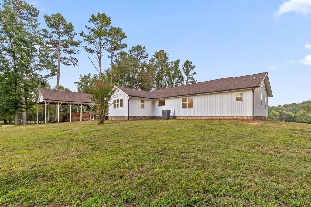 446 Brown Bridge Road Chatsworth, GA 30705 - Photo 42 of 77 a front view of a house with a garden