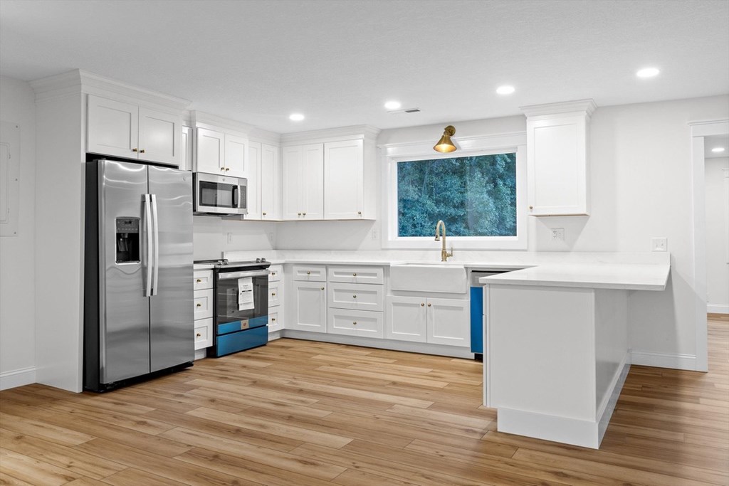 446 Brown Bridge Road Chatsworth, GA 30705 - Photo 49 of 77 a kitchen with stainless steel appliances a refrigerator sink and cabinets