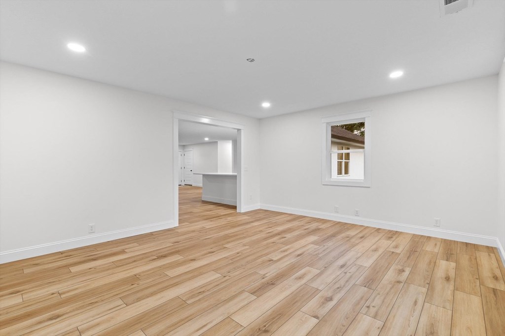 446 Brown Bridge Road Chatsworth, GA 30705 - Photo 54 of 77 a view of empty room with wooden floor and fan