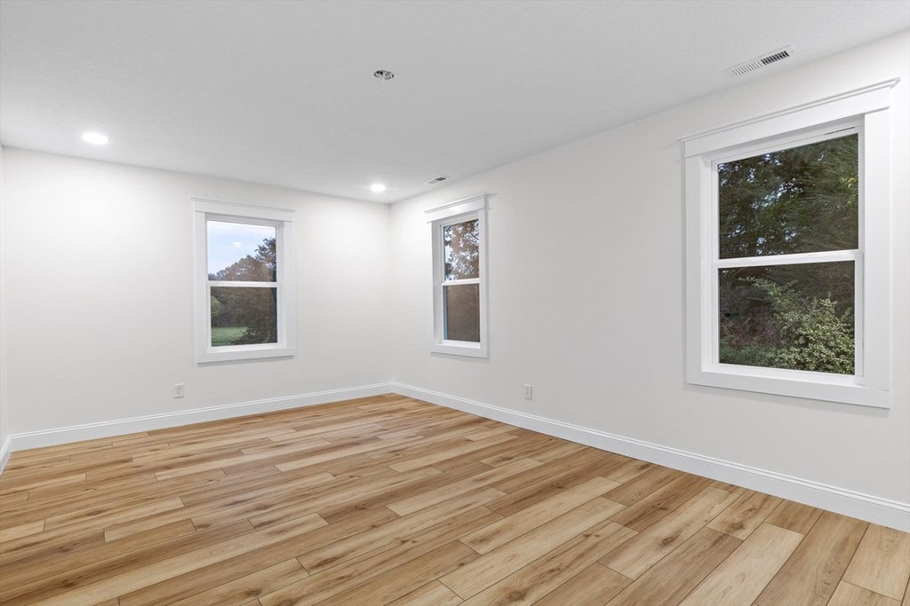 446 Brown Bridge Road Chatsworth, GA 30705 - Photo 65 of 77 a view of an empty room with wooden floor and a window