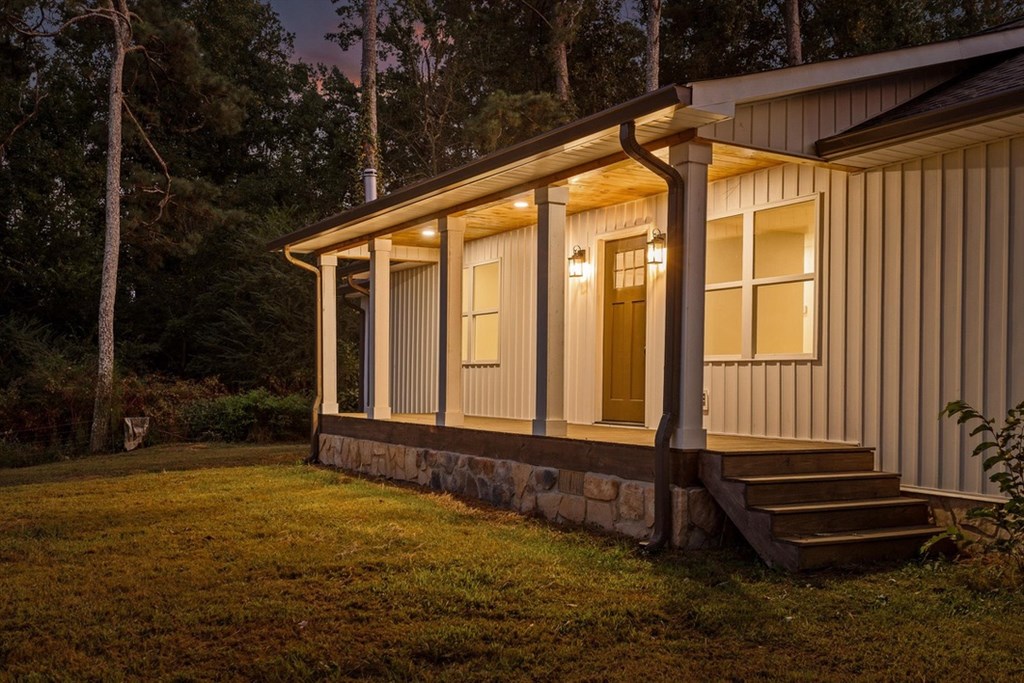 446 Brown Bridge Road Chatsworth, GA 30705 - Photo 74 of 77 a backyard of a house with wooden floor and outdoor seating