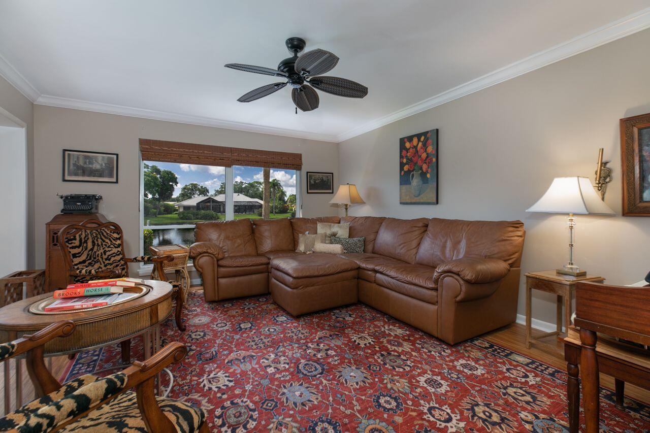 5606 Southeast Foxcross Place Stuart, FL 34997 - Photo 13 of 65 a living room with furniture and a large window