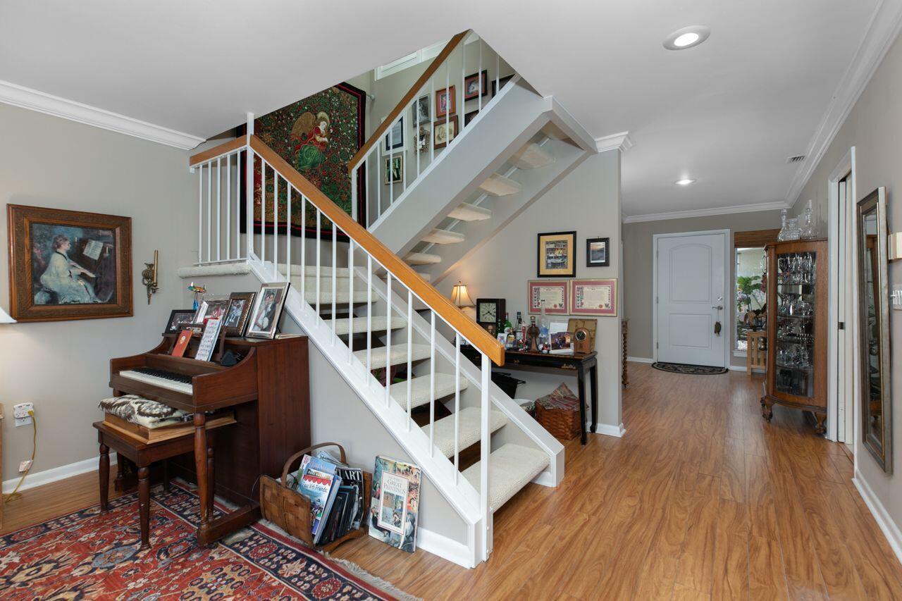 5606 Southeast Foxcross Place Stuart, FL 34997 - Photo 18 of 65 a view of entryway livingroom and hall with wooden floor