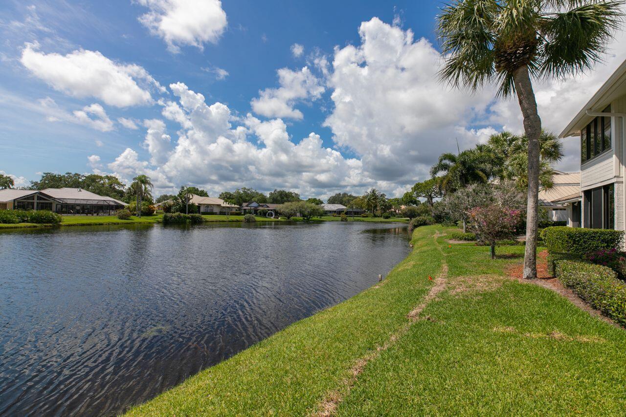 5606 Southeast Foxcross Place Stuart, FL 34997 - Photo 32 of 65 a view of a lake in front of house