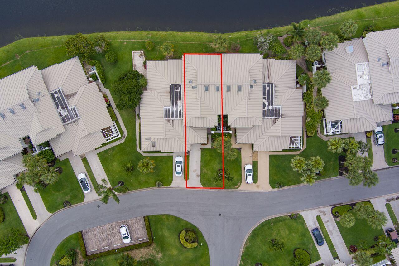 5606 Southeast Foxcross Place Stuart, FL 34997 - Photo 35 of 65 an aerial view of a house with outdoor space patio and outdoor seating