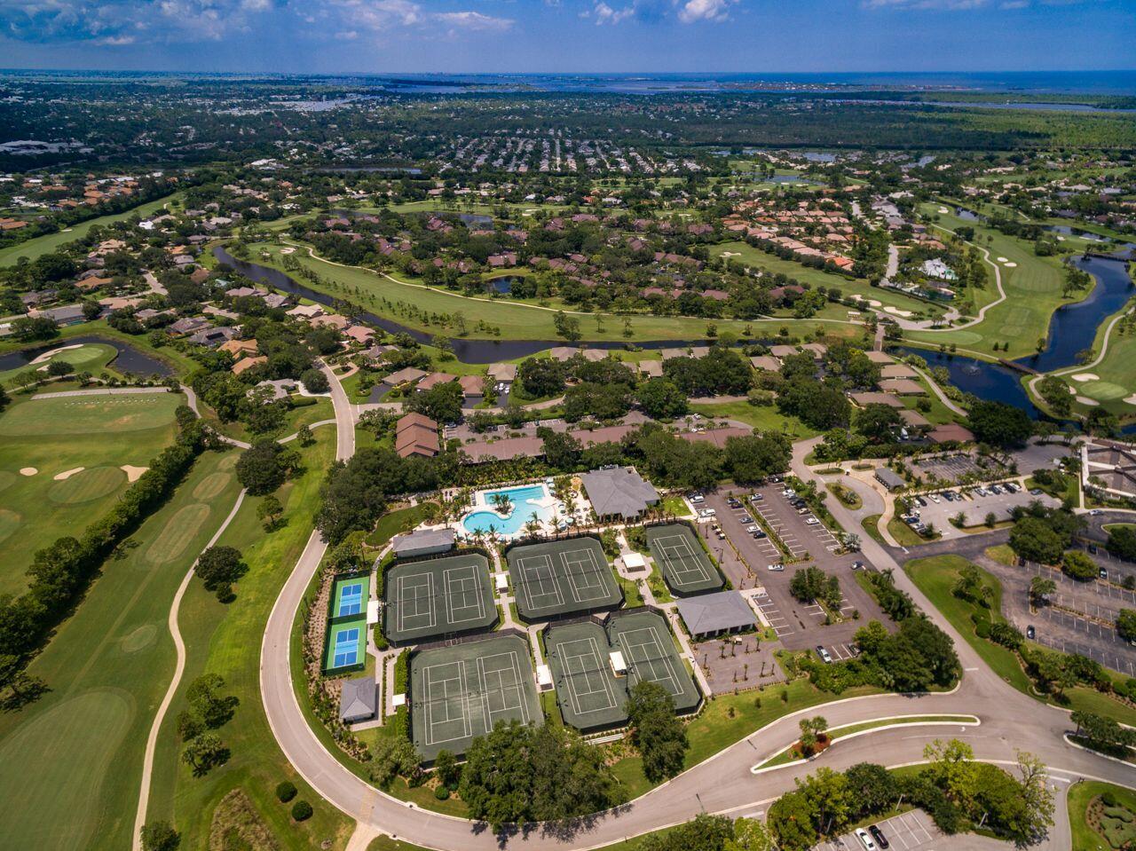 5606 Southeast Foxcross Place Stuart, FL 34997 - Photo 39 of 65 an aerial view of residential houses with outdoor space