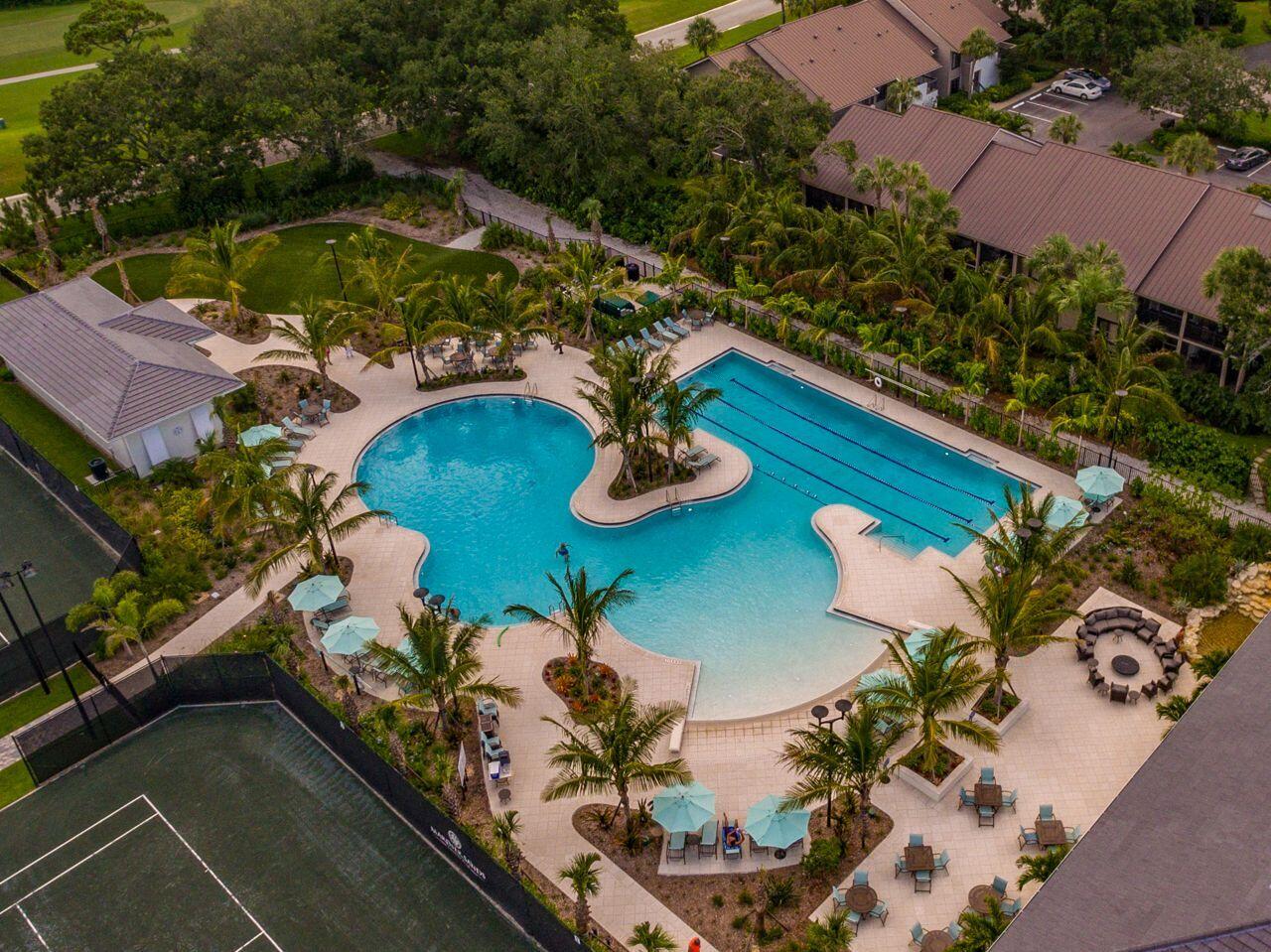 5606 Southeast Foxcross Place Stuart, FL 34997 - Photo 40 of 65 an aerial view of a house with yard swimming pool and outdoor seating