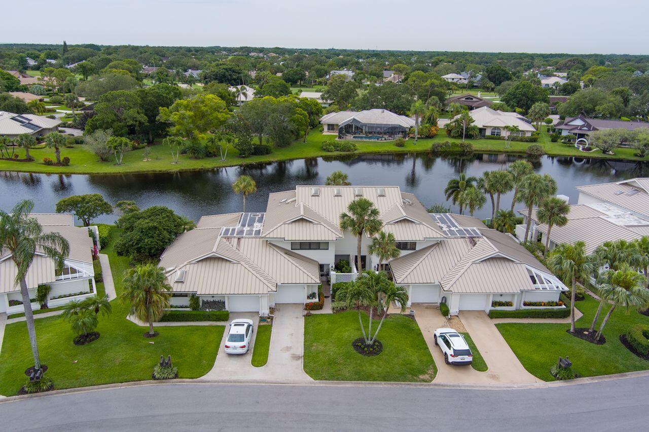 5606 Southeast Foxcross Place Stuart, FL 34997 - Photo 4 of 65 an aerial view of a house with a lake view