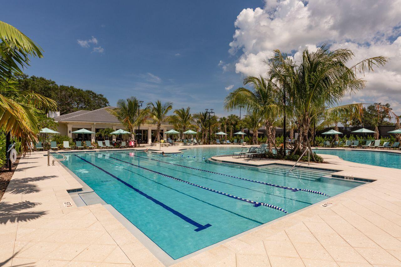5606 Southeast Foxcross Place Stuart, FL 34997 - Photo 45 of 65 a view of swimming pool with outdoor seating and city view