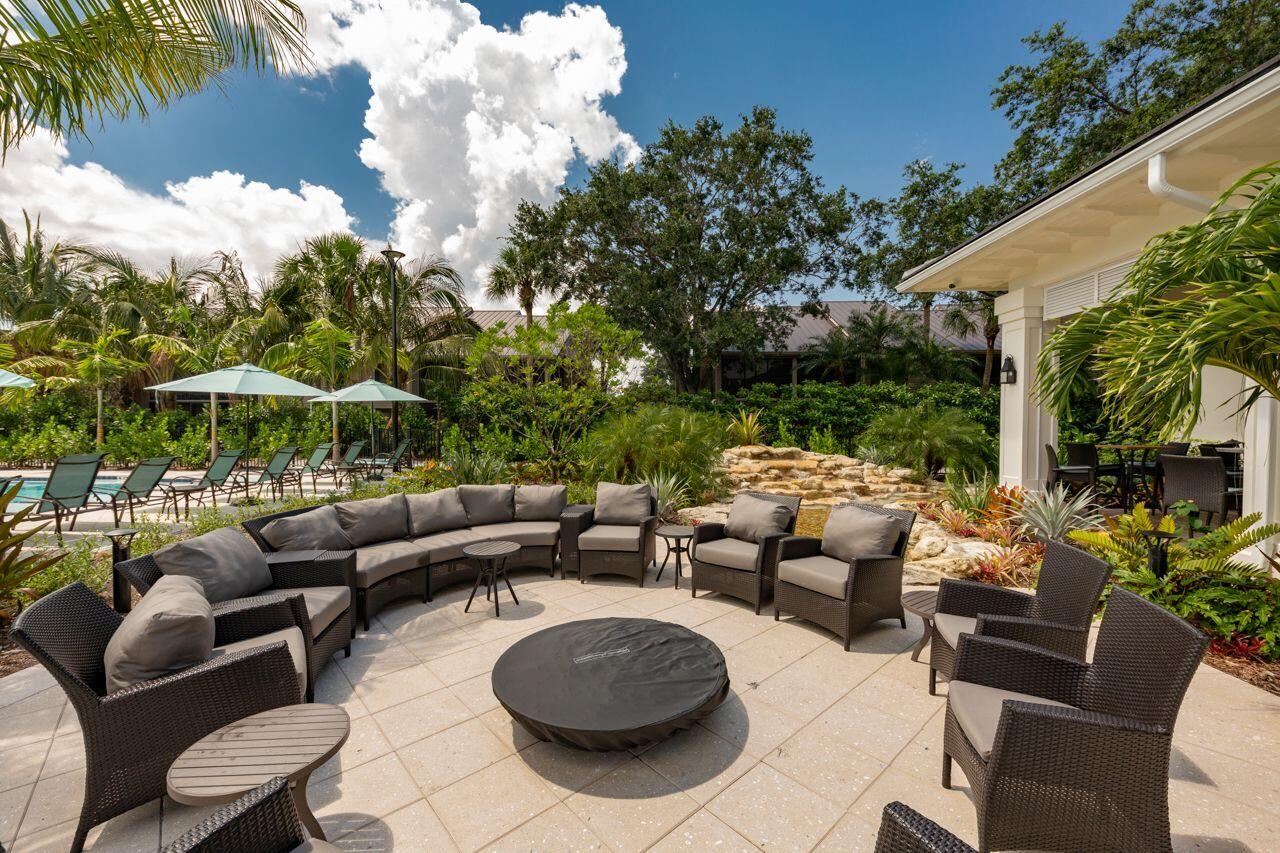 5606 Southeast Foxcross Place Stuart, FL 34997 - Photo 50 of 65 a outdoor living space with furniture and garden view