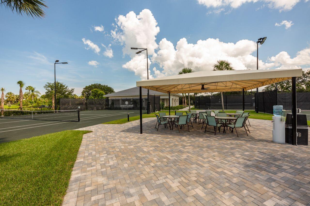 5606 Southeast Foxcross Place Stuart, FL 34997 - Photo 58 of 65 a view of a house with backyard porch and sitting area