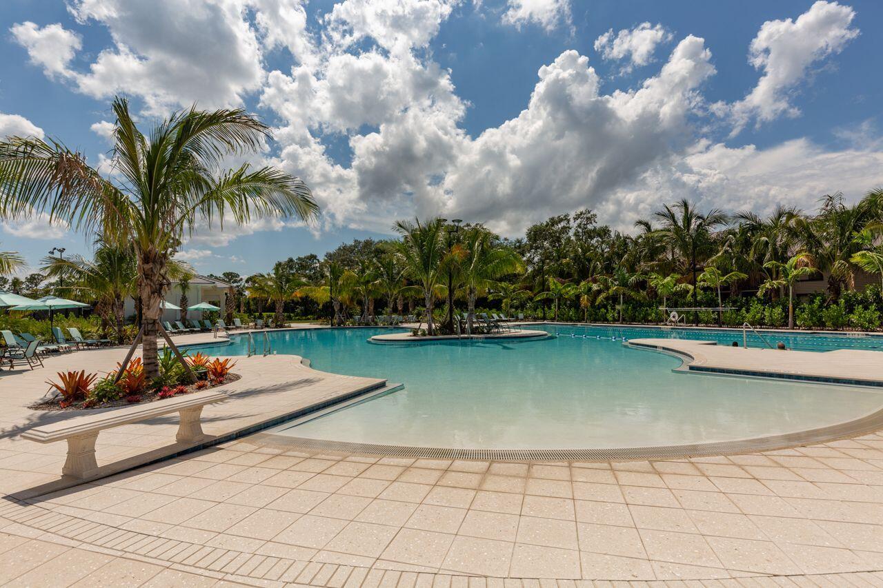 5606 Southeast Foxcross Place Stuart, FL 34997 - Photo 61 of 65 a view of swimming pool with outdoor seating and plants