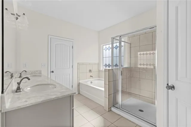 a view of a kitchen with white cabinets