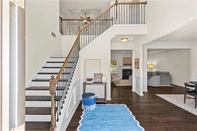 a view of entryway and hall with wooden floor