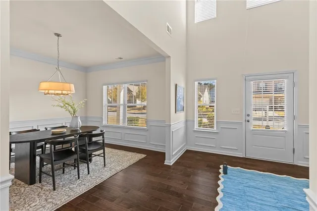 a view of a livingroom with furniture window and wooden floor