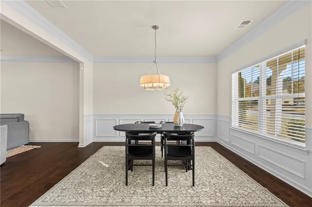 a dining room with wooden floor
