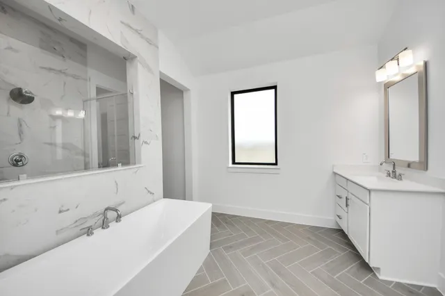 aerial view of a house with a garden and outdoor seating