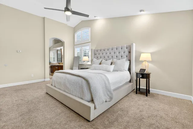 a view of an empty room with a cabinet and a window