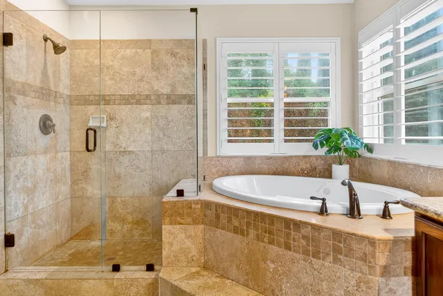 a bedroom with furniture and a flat screen tv