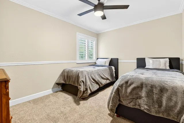 a view of a patio with couches table and chairs and potted plants