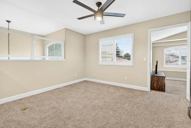 an aerial view of a house with a yard basket ball court and outdoor seating
