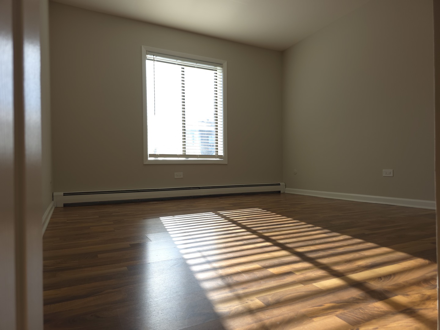 412 East Bailey Road, Unit 104 Naperville, IL 60565 - Photo 9 of 11 a view of wooden floor and windows in a room