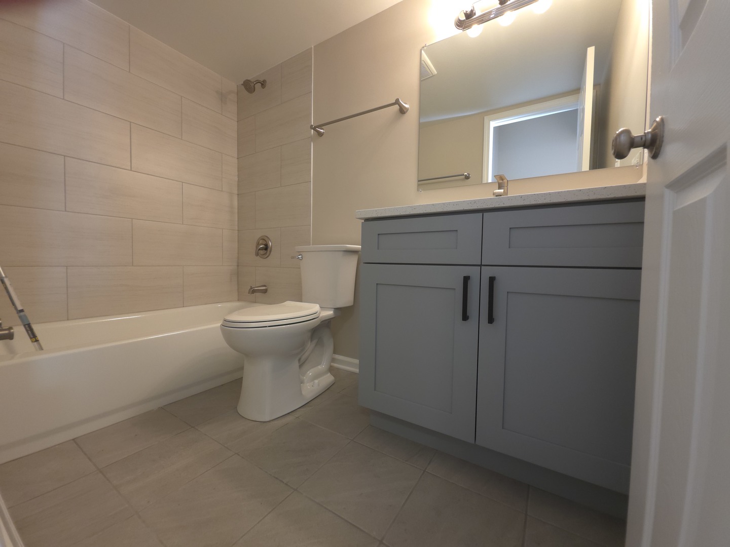 412 East Bailey Road, Unit 104 Naperville, IL 60565 - Photo 10 of 11 a bathroom with a sink a toilet and shower