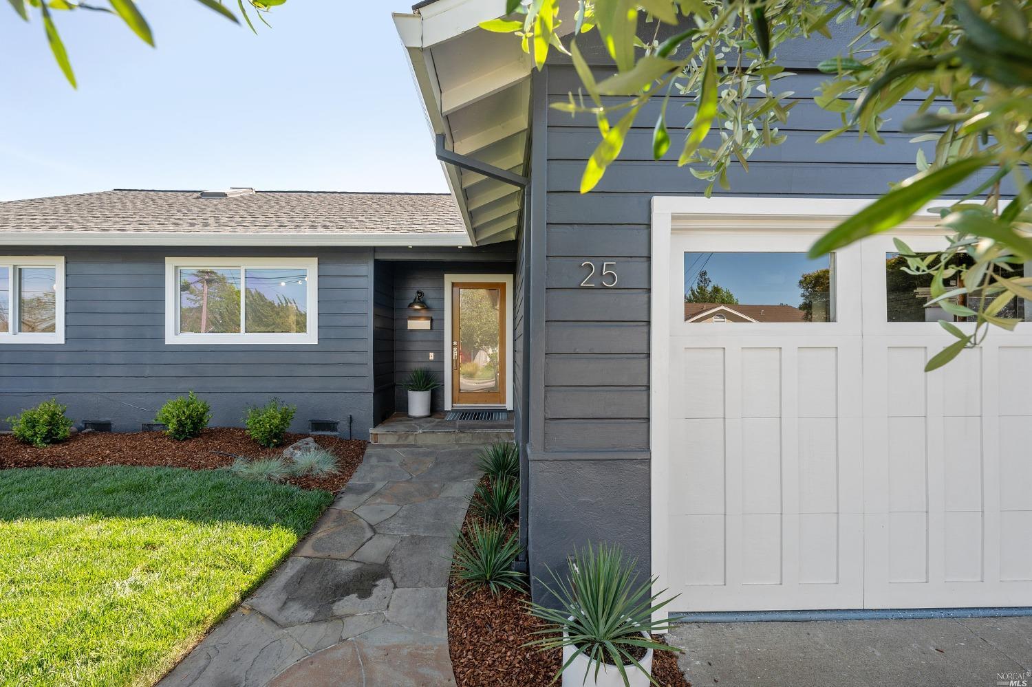 25 Flying Cloud Course Corte Madera, CA 94925 - Photo 1 of 1 a front view of a house with garden