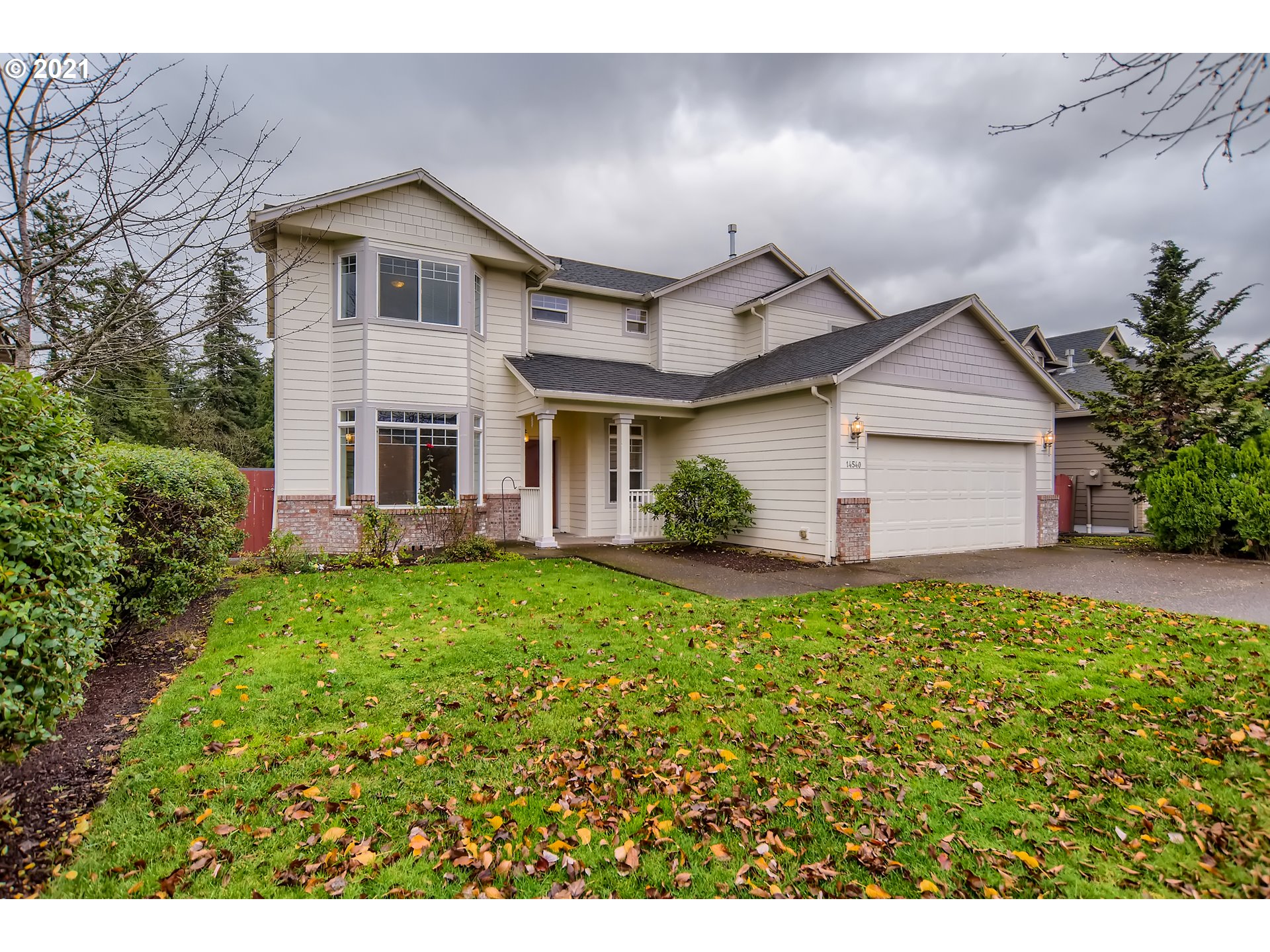 14540 Southeast Marci Way Clackamas, OR 97015 - Photo 2 of 32 a view of a yard in front of house