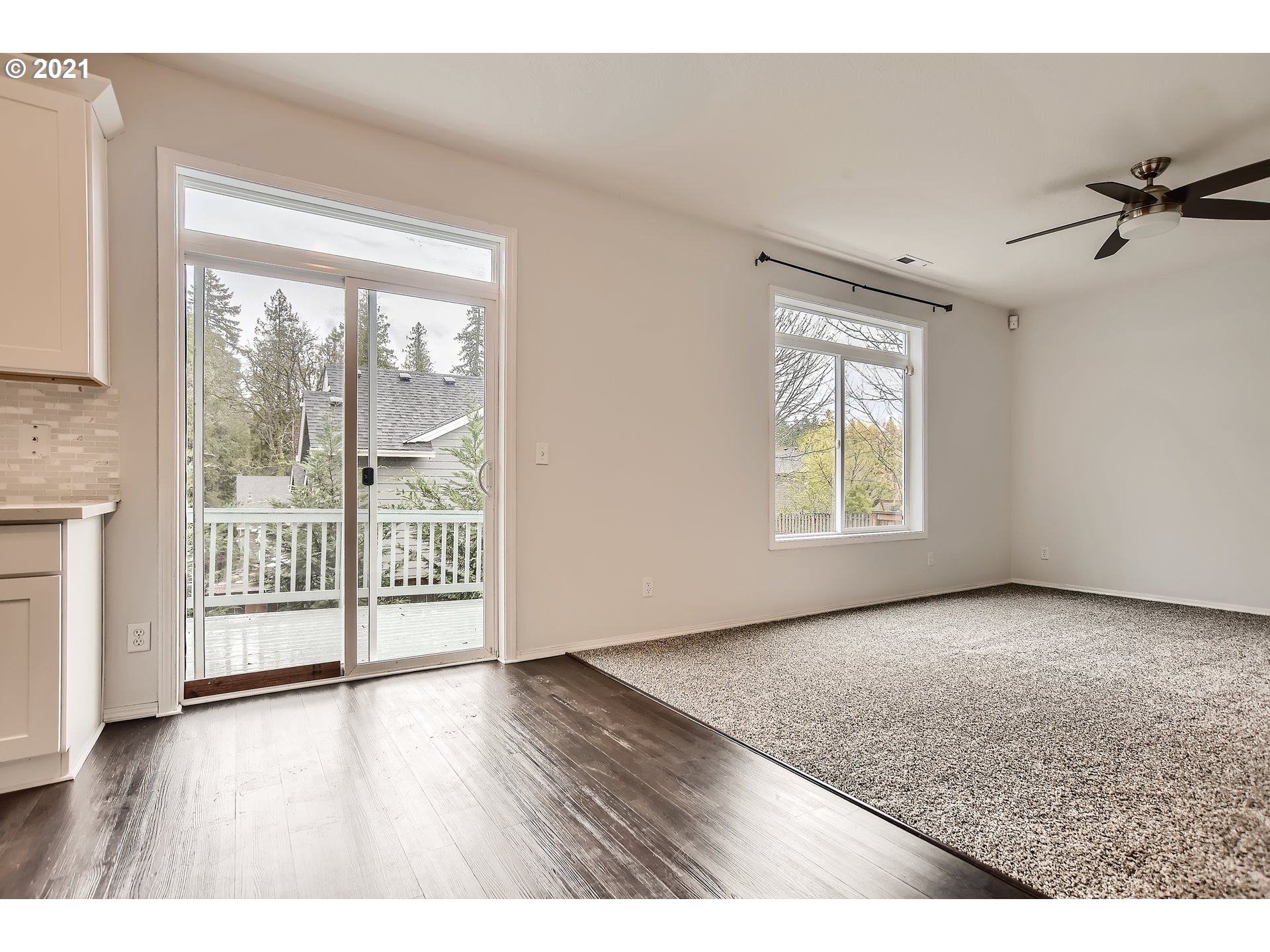 14540 Southeast Marci Way Clackamas, OR 97015 - Photo 11 of 32 an empty room with wooden floor and windows