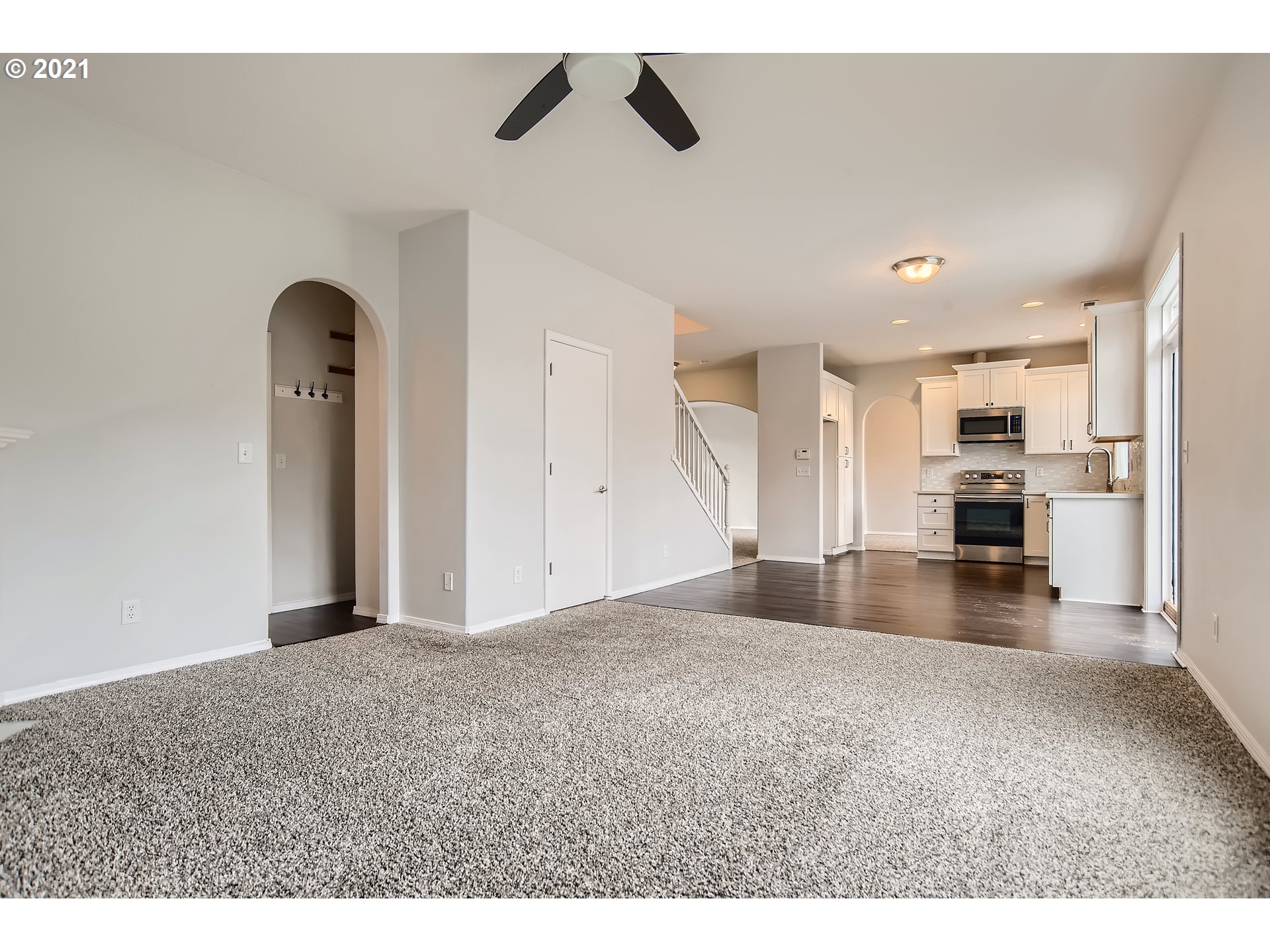 14540 Southeast Marci Way Clackamas, OR 97015 - Photo 13 of 32 a view of a livingroom with furniture and a ceiling fan