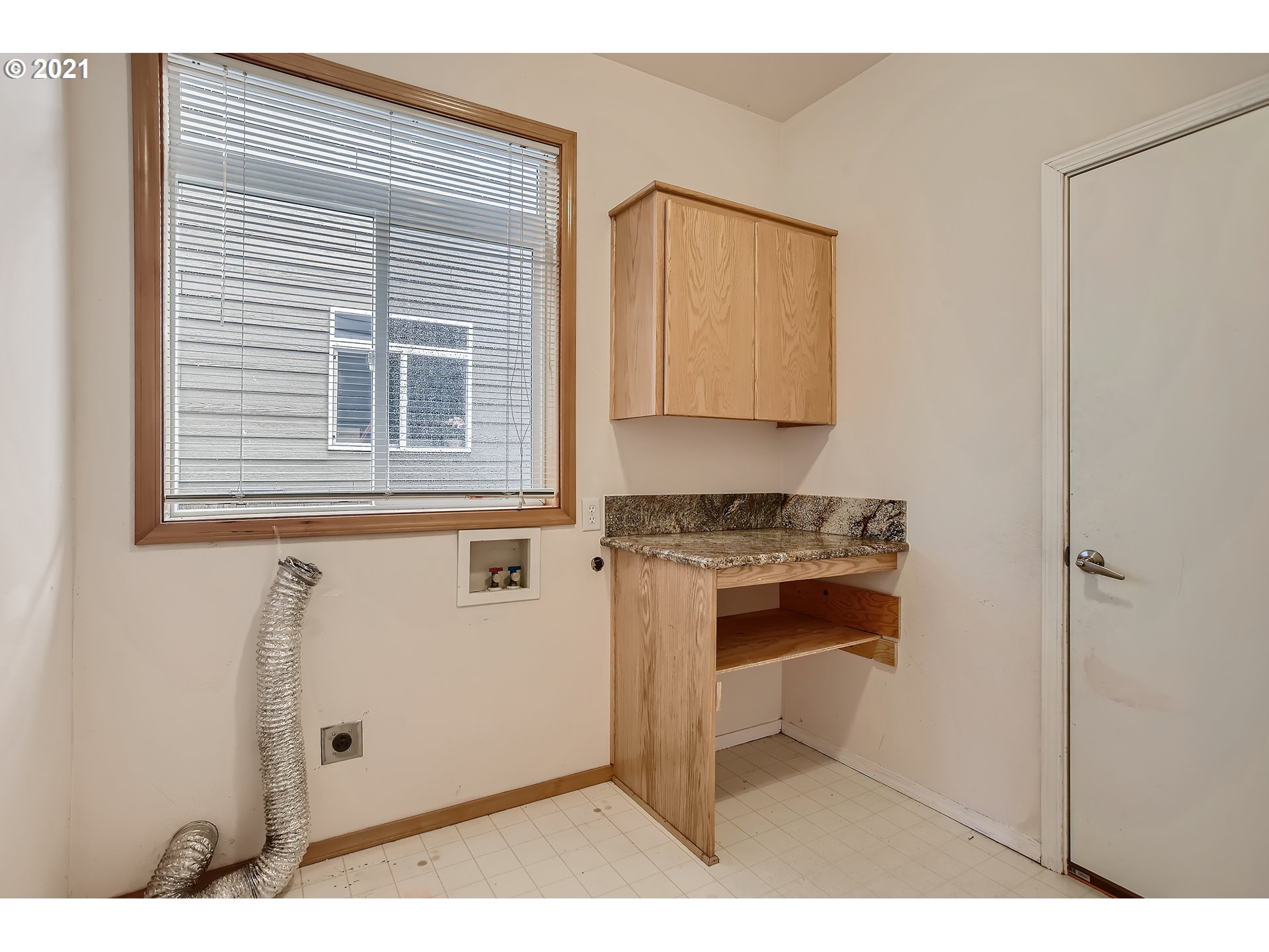 14540 Southeast Marci Way Clackamas, OR 97015 - Photo 27 of 32 a kitchen with a stove and a microwave