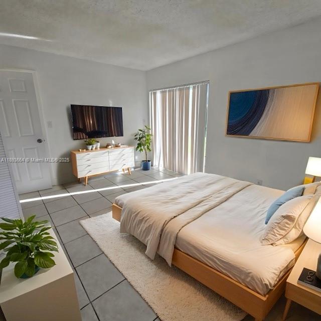 Lakeshore at University Park Miramar, FL 33025 - Photo 4 of 10 a bedroom with a bed a television and a couch