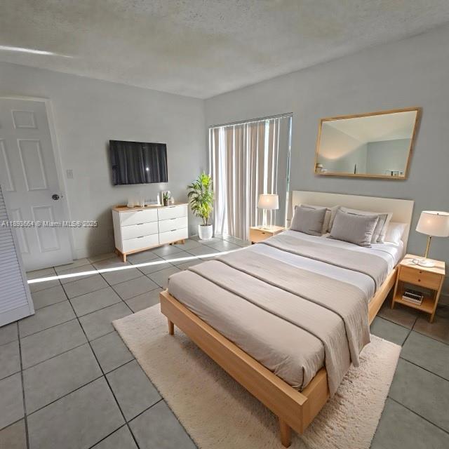 Lakeshore at University Park Miramar, FL 33025 - Photo 5 of 10 a bedroom with a bed and a couch