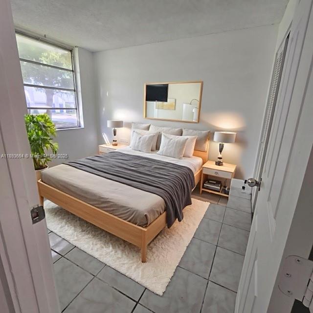 Lakeshore at University Park Miramar, FL 33025 - Photo 7 of 10 a bedroom with a bed and a window