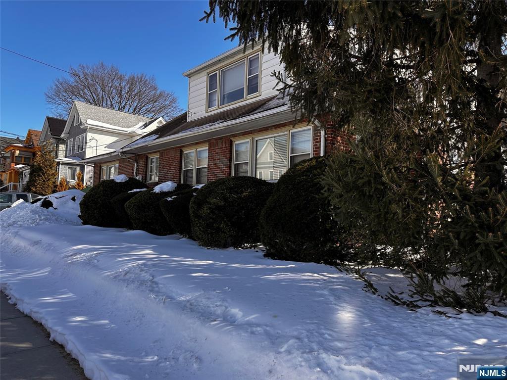 295 Grove Street, Unit 2 East Rutherford, NJ 07073 - Photo 2 of 9 a front view of a house with a yard