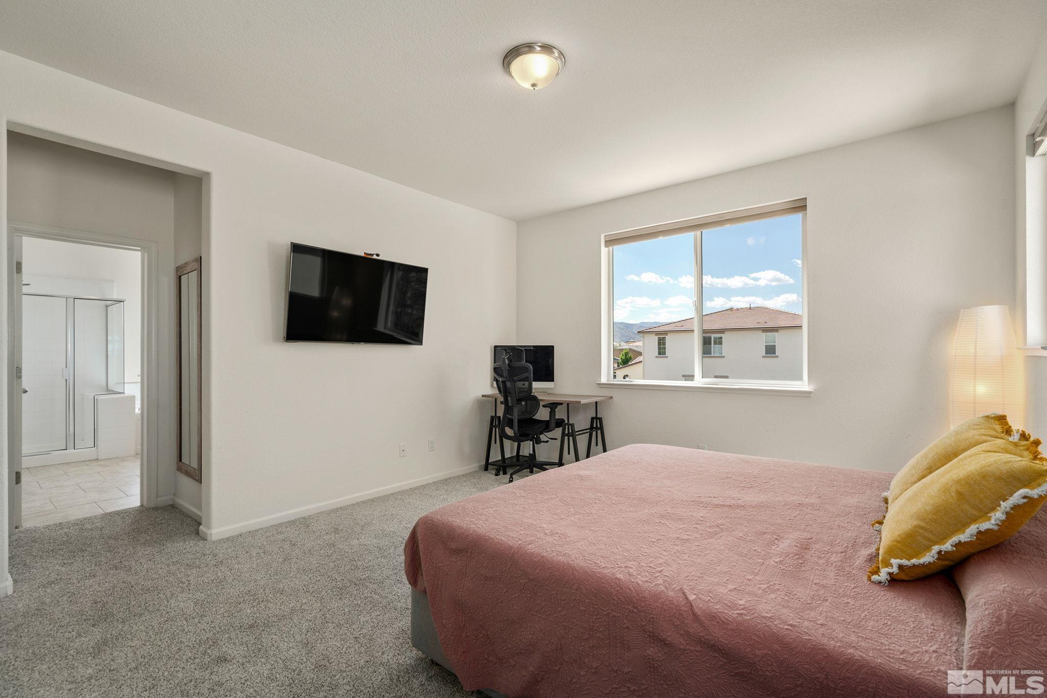 1950 Hope Valley Drive Reno, NV 89521 - Photo 17 of 32 a bedroom with a bed and a tv