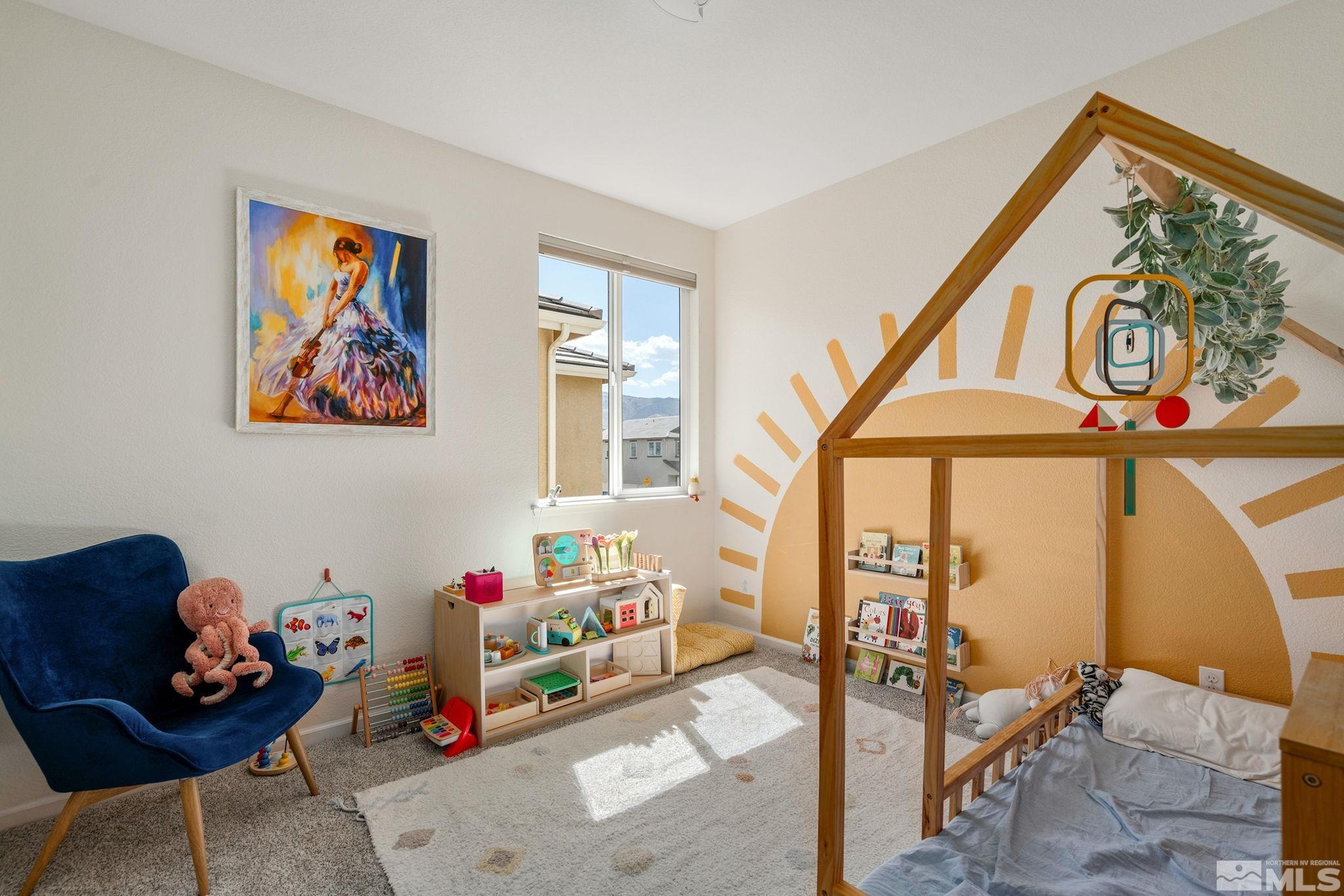 1950 Hope Valley Drive Reno, NV 89521 - Photo 21 of 32 a garage with toys and a painting on the wall