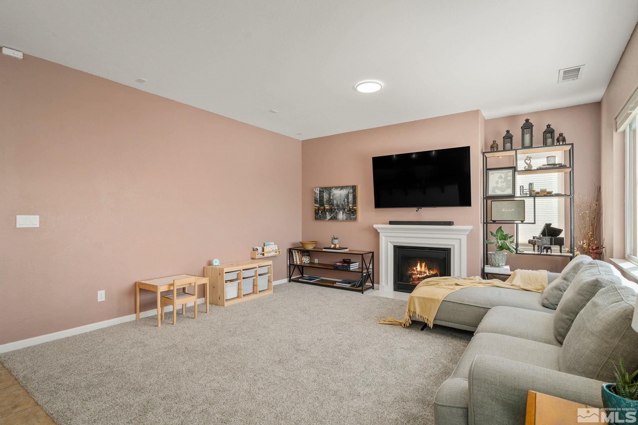 1950 Hope Valley Drive Reno, NV 89521 - Photo 7 of 32 a living room with furniture and a flat screen tv