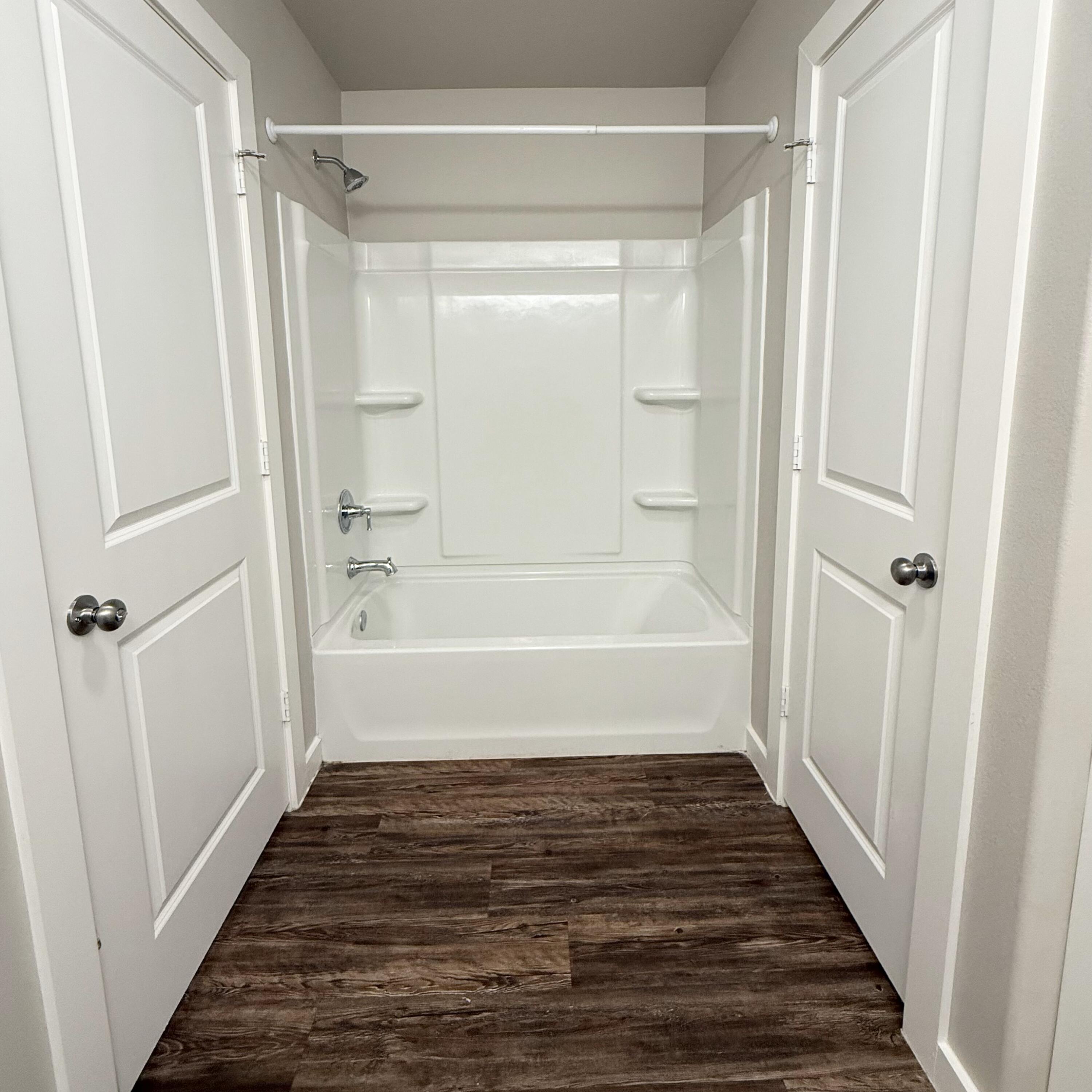 2108 North Jayton Avenue, Unit A Lubbock, TX 79403 - Photo 12 of 17 a bathroom with a bathtub and a shower