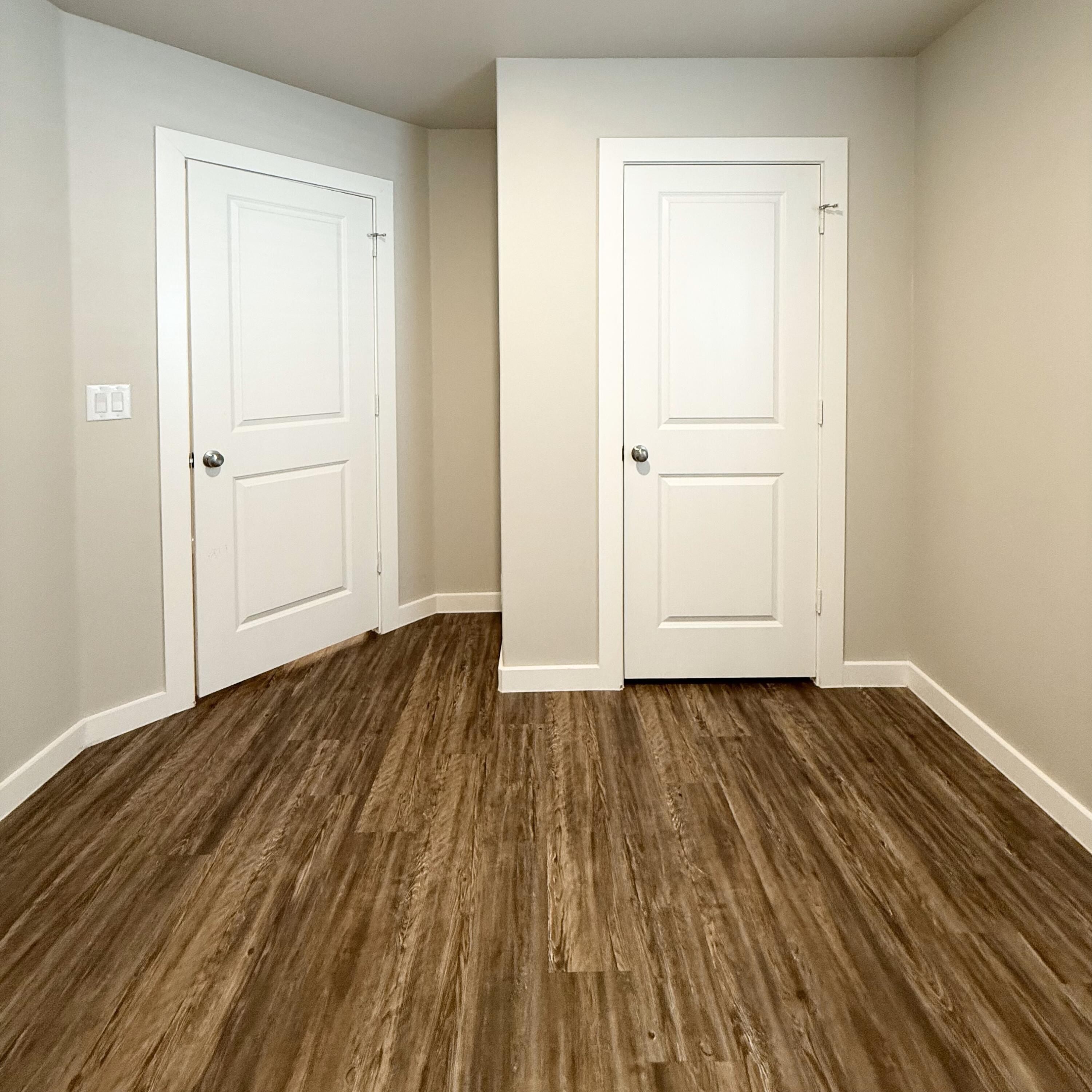 2108 North Jayton Avenue, Unit A Lubbock, TX 79403 - Photo 14 of 17 a view of a room with wooden floor and closet