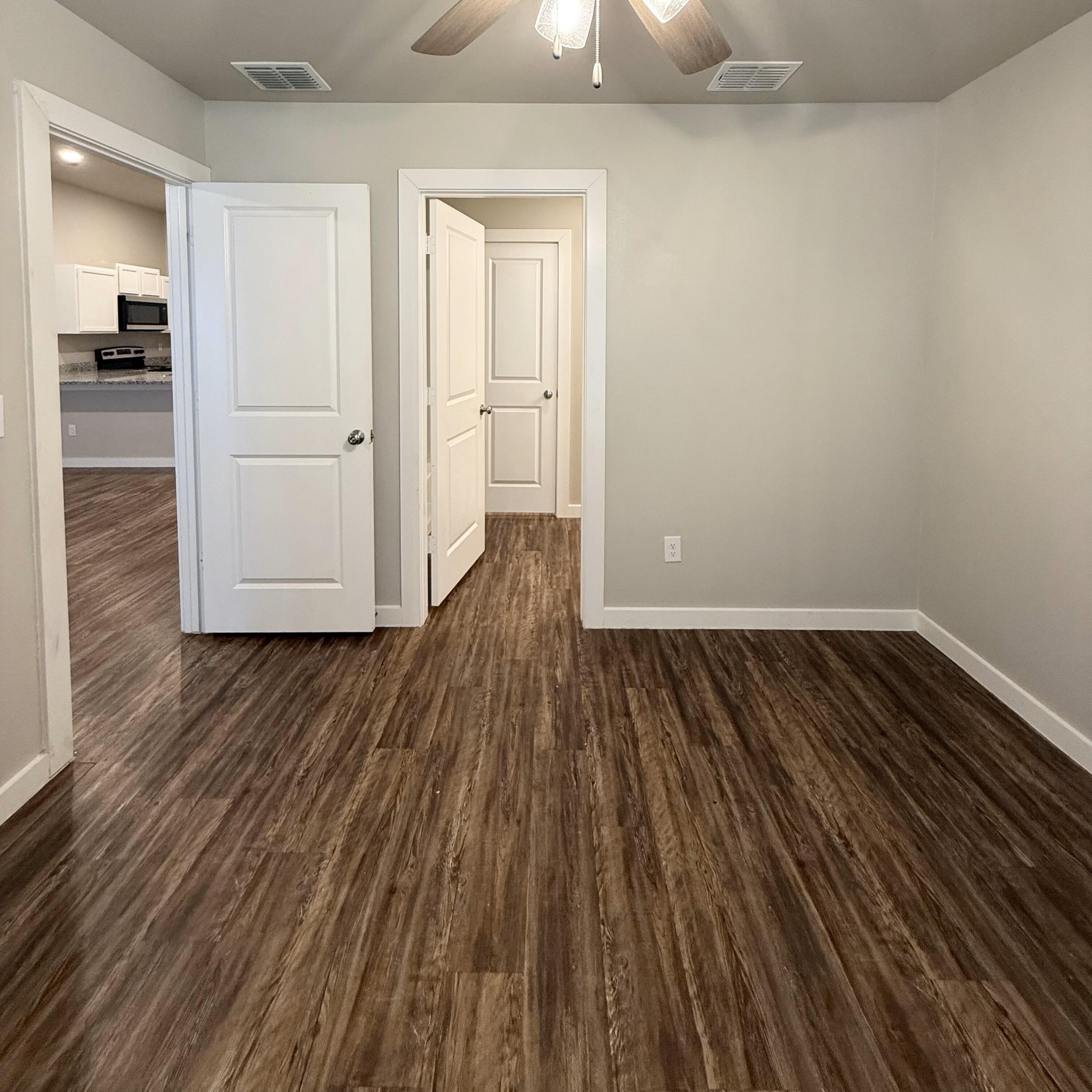 2108 North Jayton Avenue, Unit A Lubbock, TX 79403 - Photo 10 of 17 wooden floor in an empty room