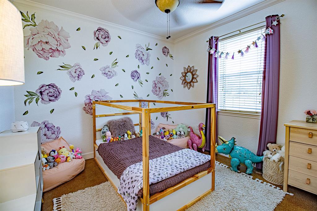 328 Meadow Lane Red Oak, TX 75154 - Photo 10 of 35 Carpeted bedroom featuring ornamental molding and a ceiling fan