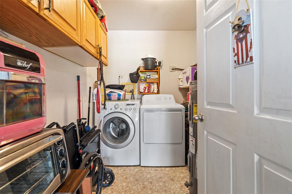 2830 Horton Road Kissimmee, FL 34744 - Photo 23 of 35 a utility room with dryer and washer