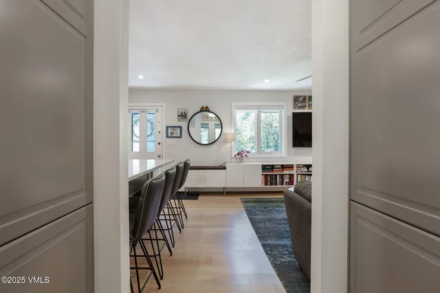 a view of a hallway with seating area