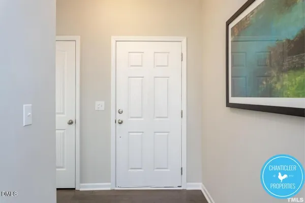 a view of an entryway with wooden floor